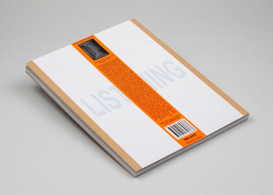 A paperback book titled "Listening" with an orange strip of paper laid across it.