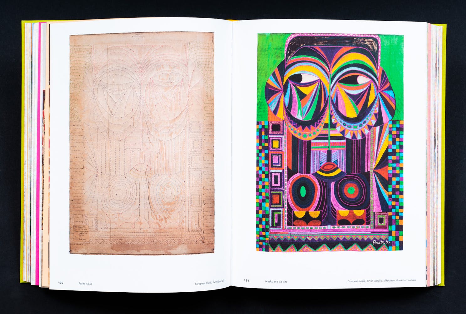 Spread of a book with colorful paintings.