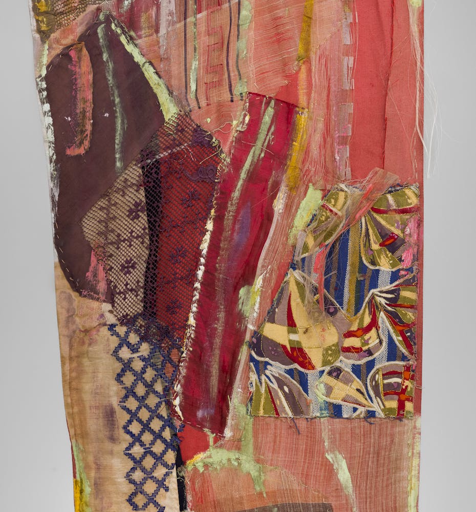 Close up image of an artwork made from a mixture of colorful fabircs and sewing techniques.