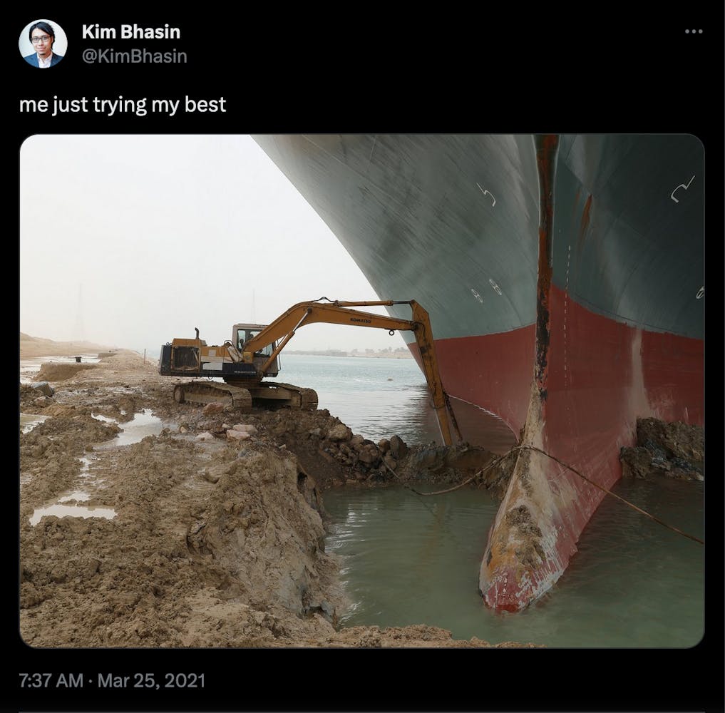 Screen grab of a twiter post of a large machinery working to free a large ship from being stuck in a river.