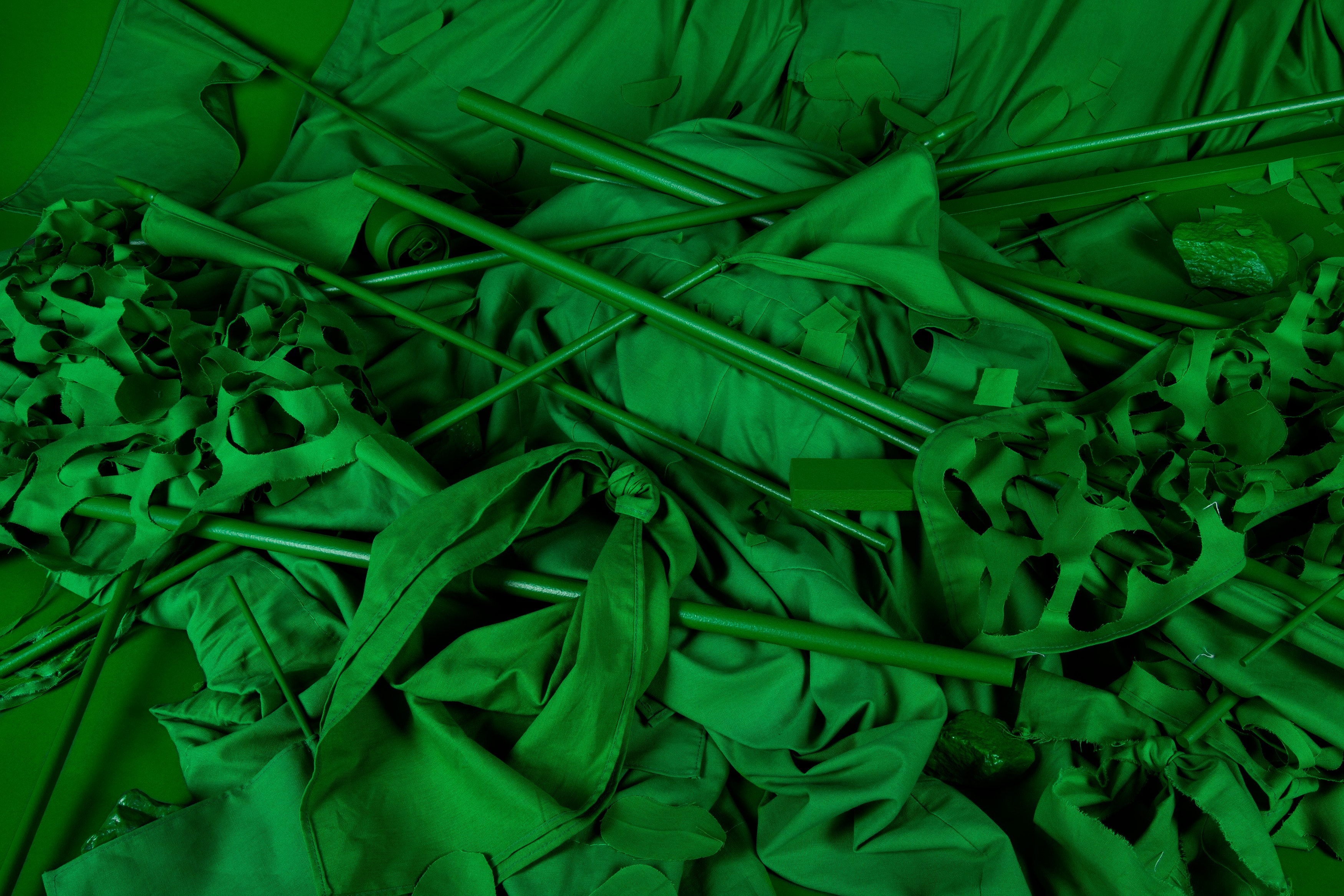 Image of all green fabrics and poles