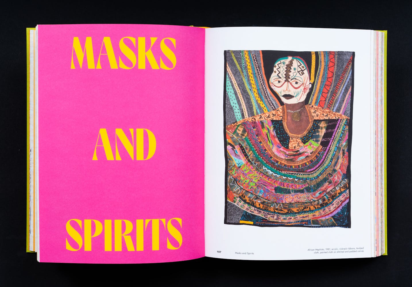 Spread of a book with colorful paintings.