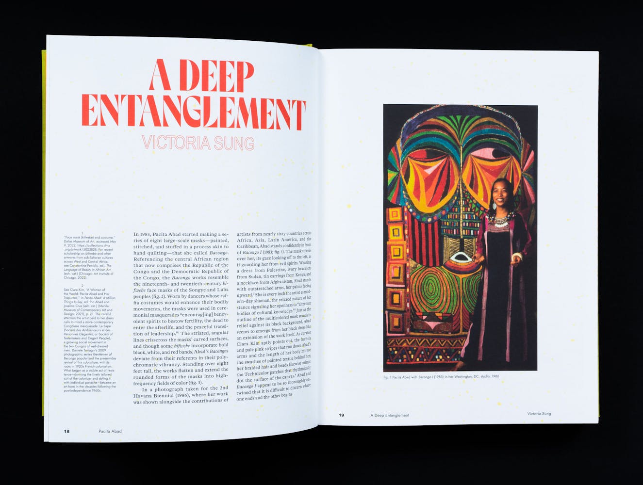 Spread of a book with colorful paintings.