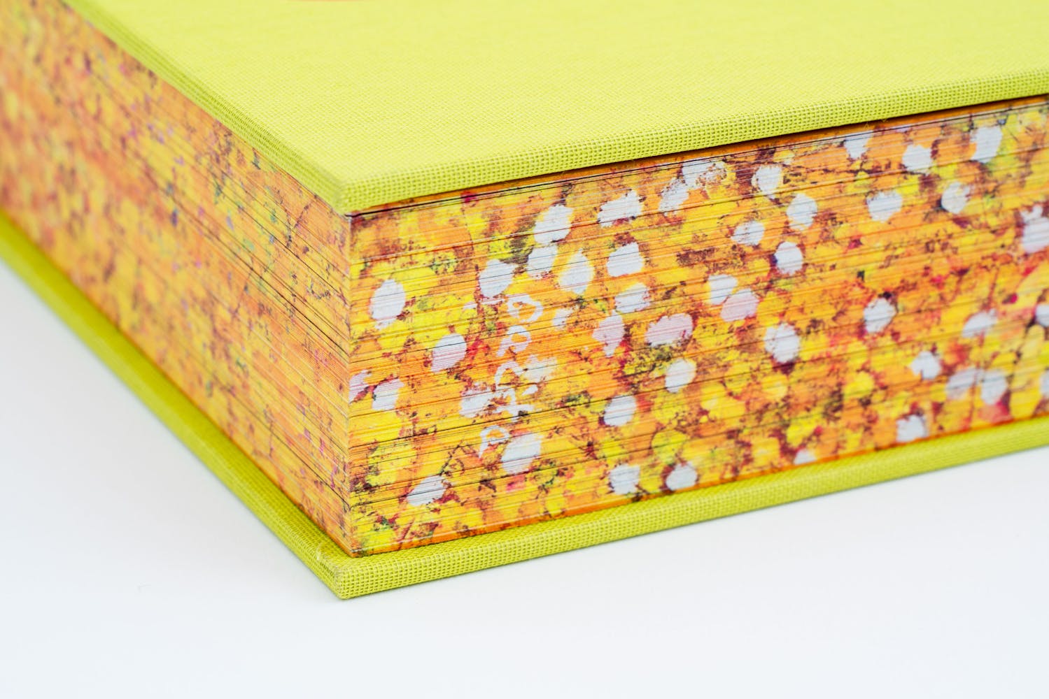 Detail of the edge of a colorful book.