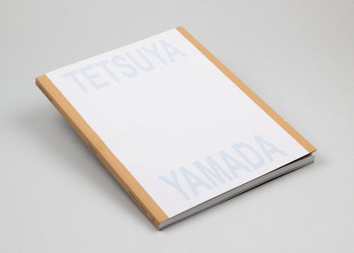 Cover of a paperback book that reads "Tetsuya Yamada" in grey.