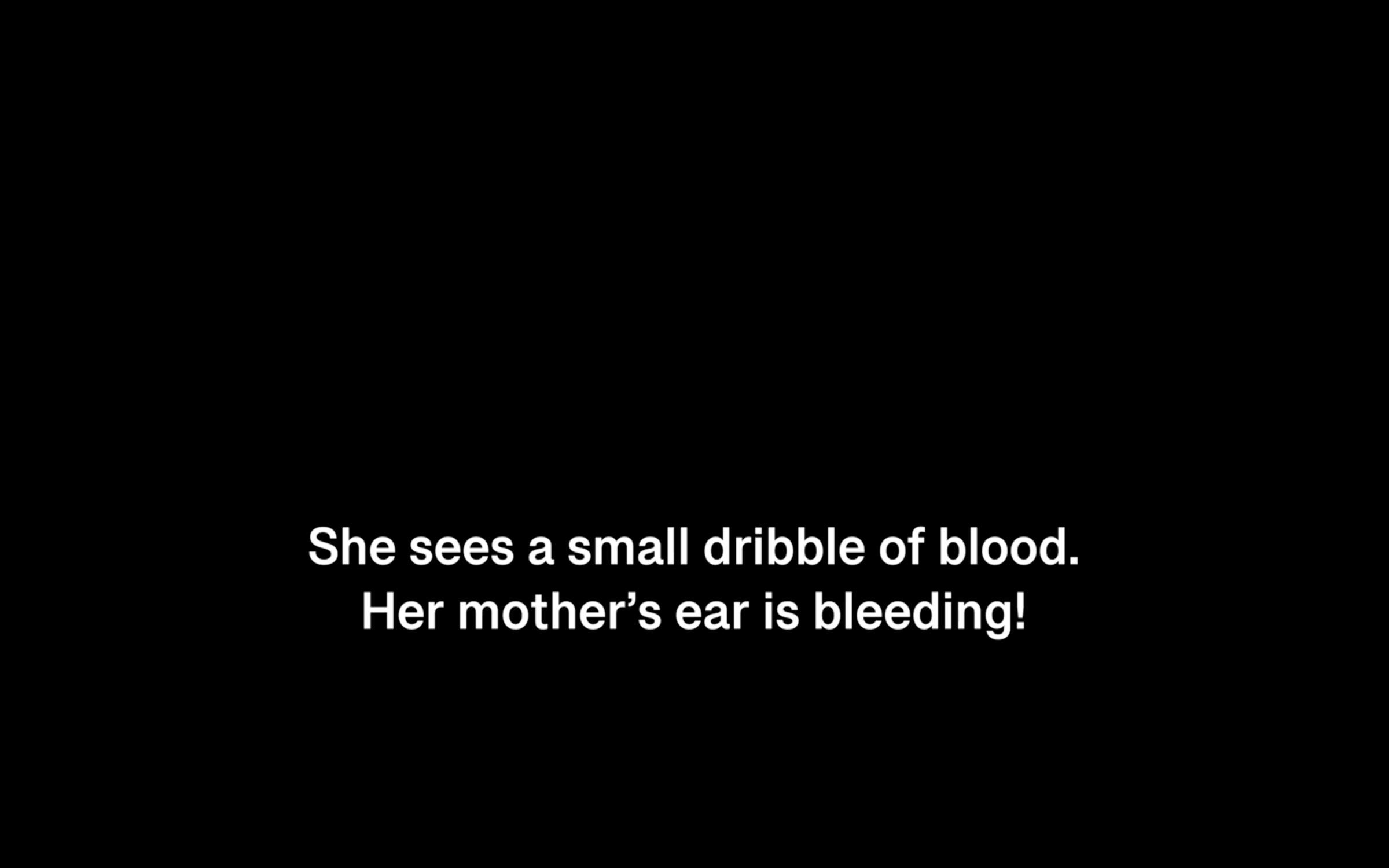 Black slide with white text captions that read “She sees a small dribble of blood. Her mother’s ear is bleeding!”