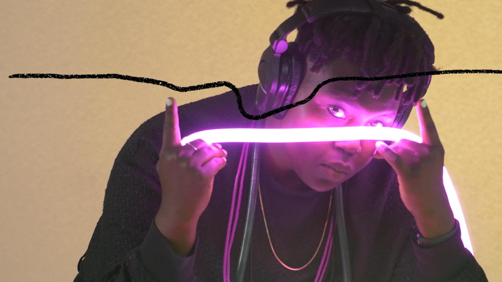 A woman holds a glowing purple band and looks at the viewer.