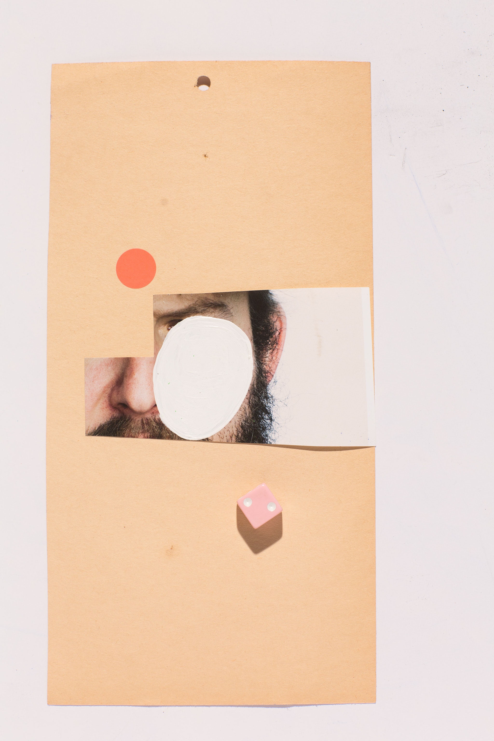 tall collage of objects and photographs