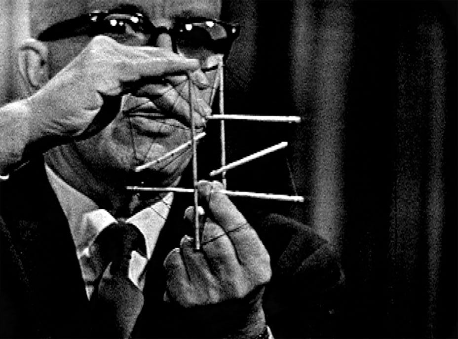 image of man holding stick model