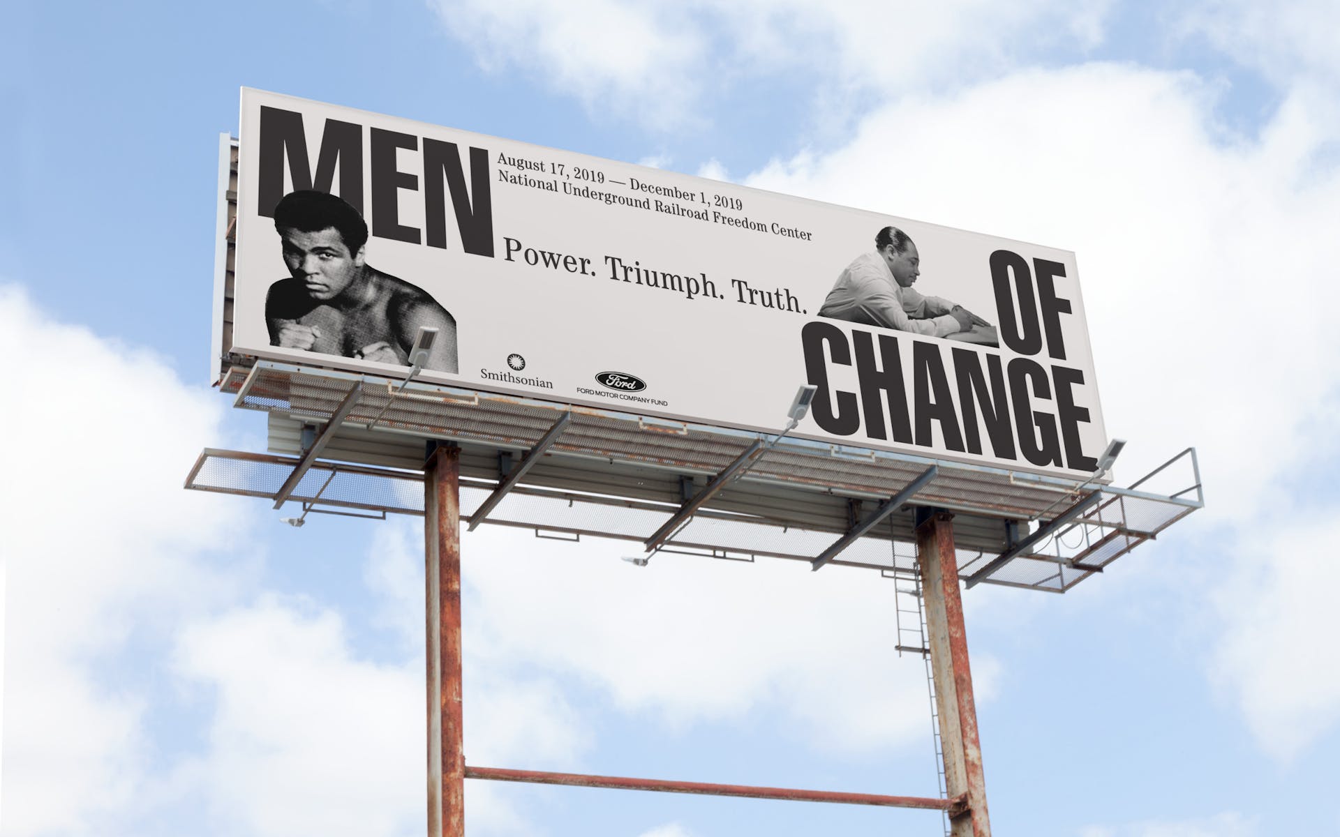 Buildboard with images of historical Black men and the words Men of Change