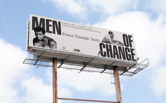 Buildboard with images of historical Black men and the words Men of Change