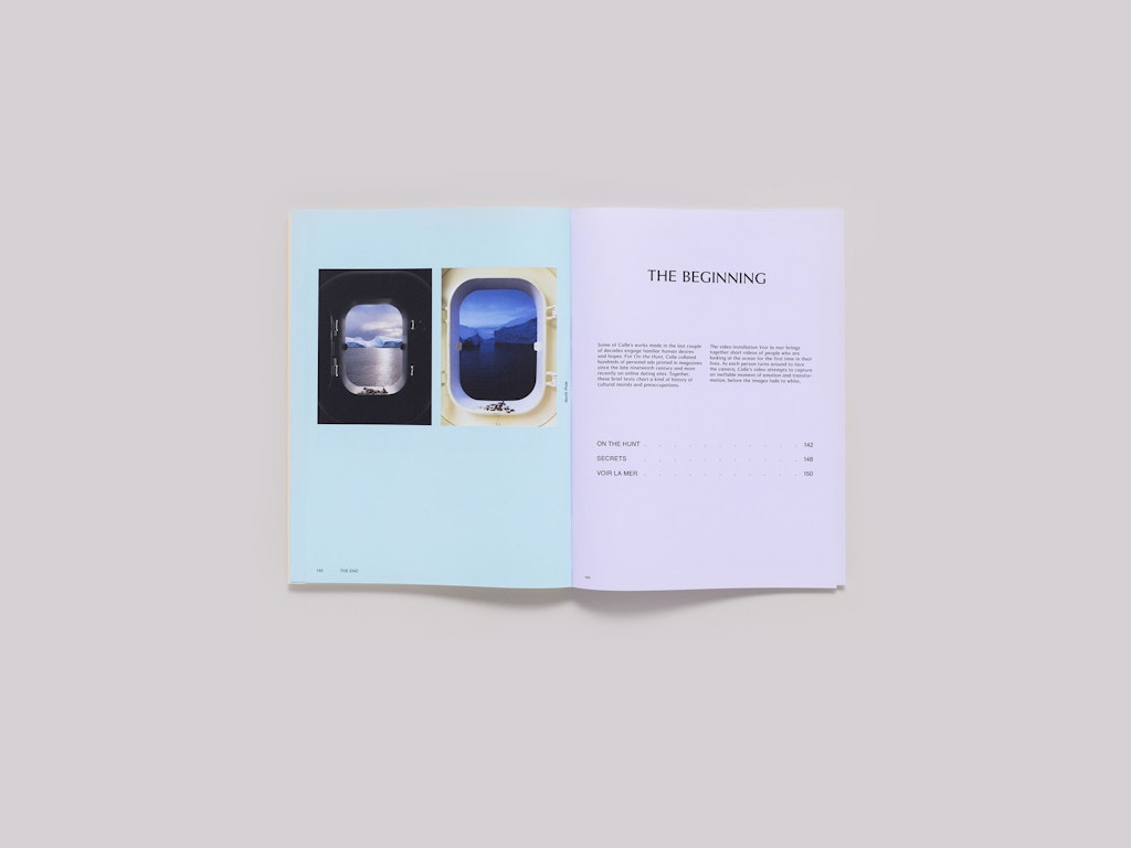 An open book on a grey tabletop.