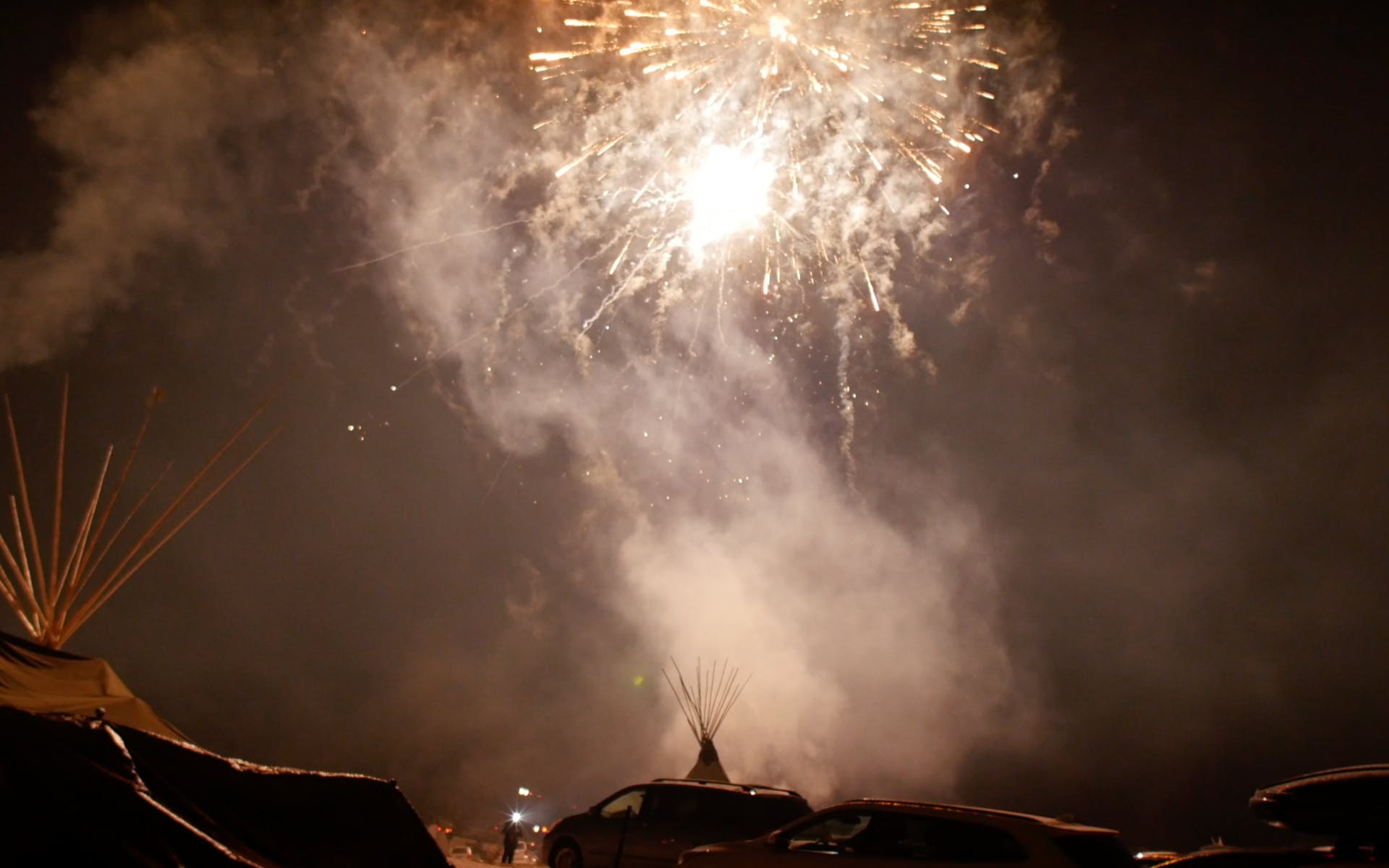 Fireworks above teepees
