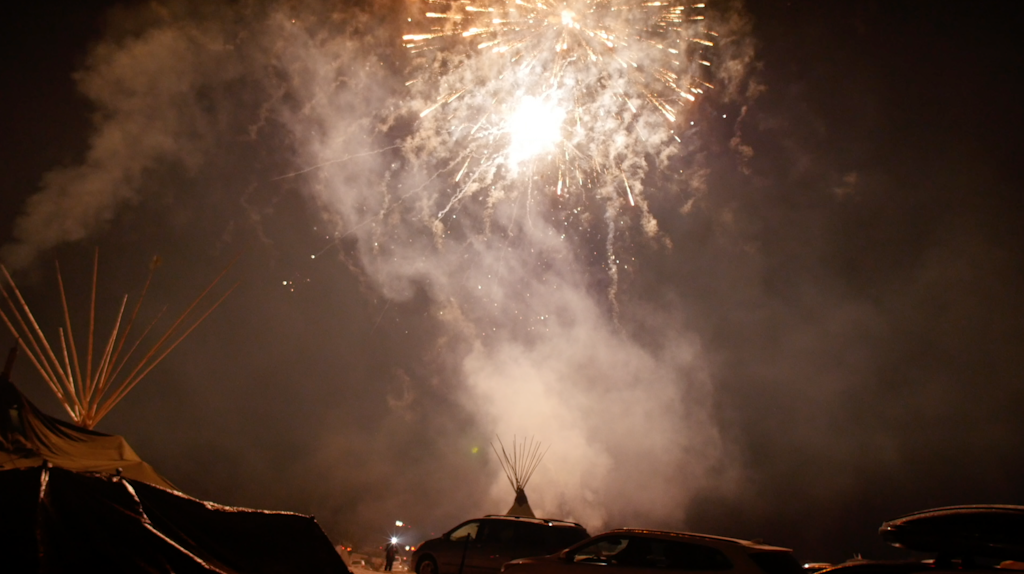 Fireworks above teepees