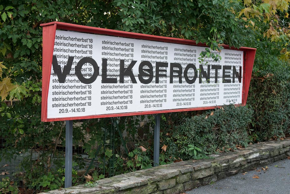 Posters line a display space outside