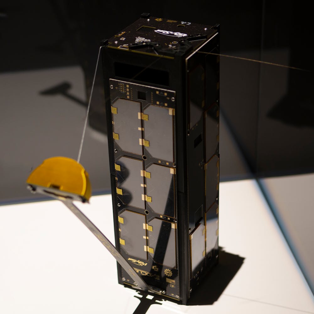 Image of rectangular satellite on display in vitrine