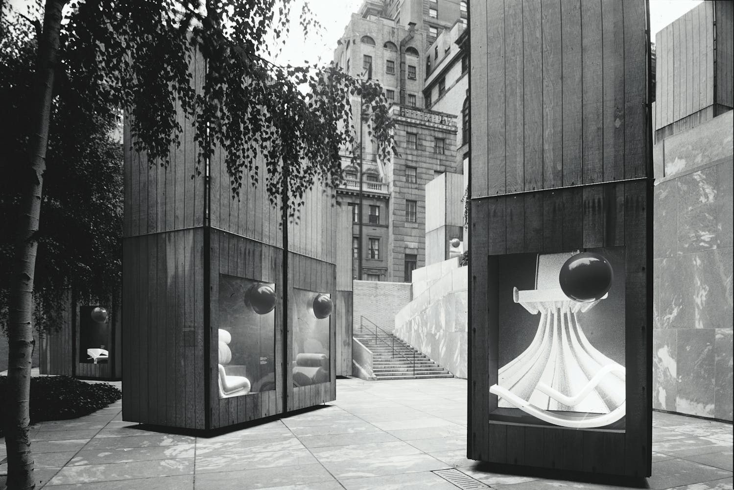 Image of objects in cases outdoors as part of exhibition display