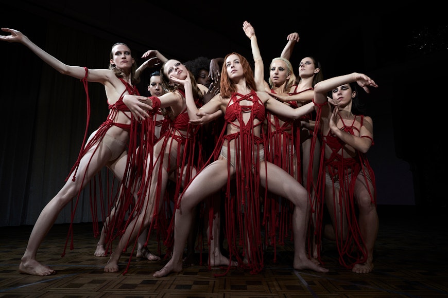Dancers wearing in red in formation