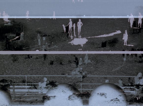 Inverted image of people outside on a beach, split into thirds