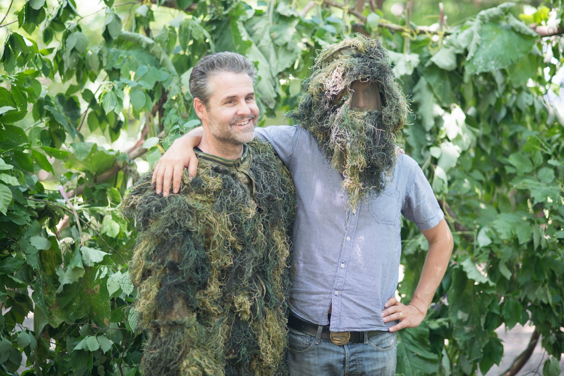 Brad Zellar in a ghillie suit, with Alec Soth