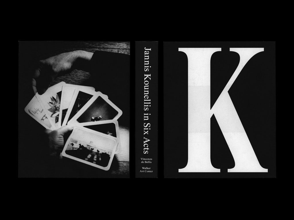 The cover of a book with a large letter K on it sits next to the spine and back cover of the same book.