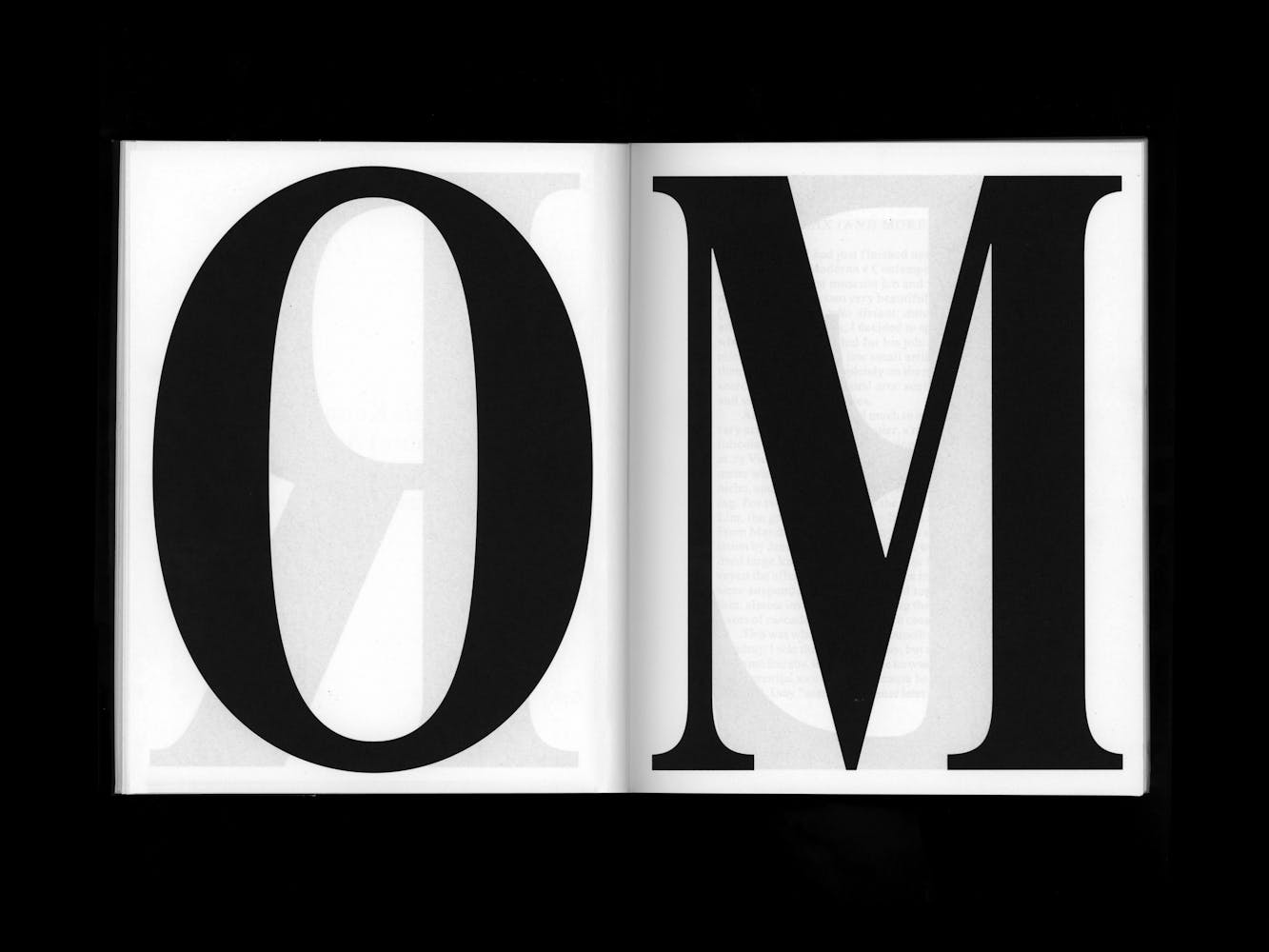 Boom spread with the large letters O and M.