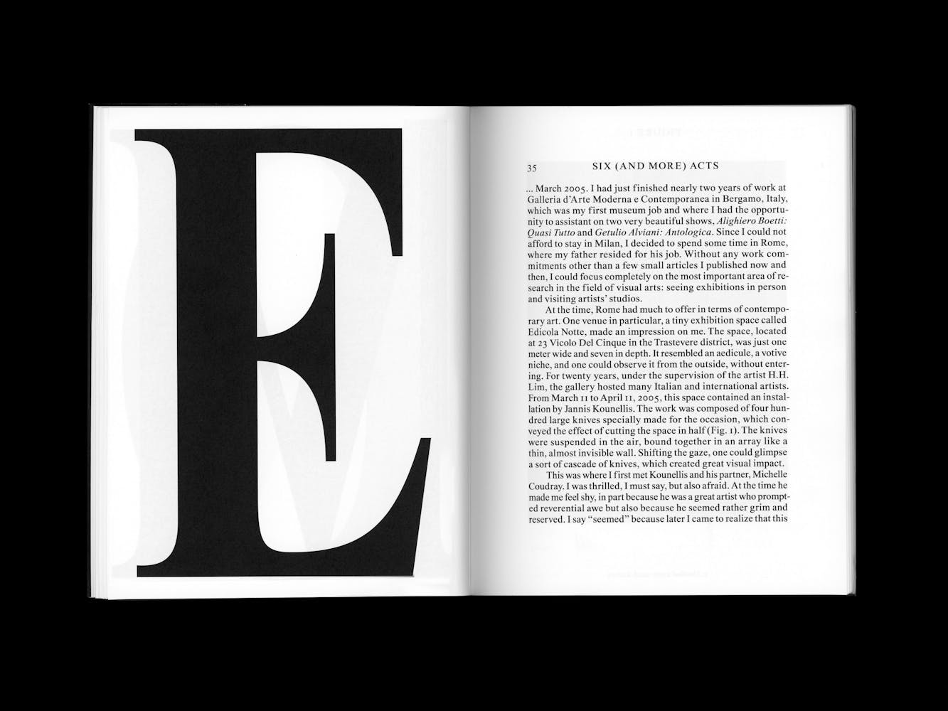 Book spread with a large letter E.