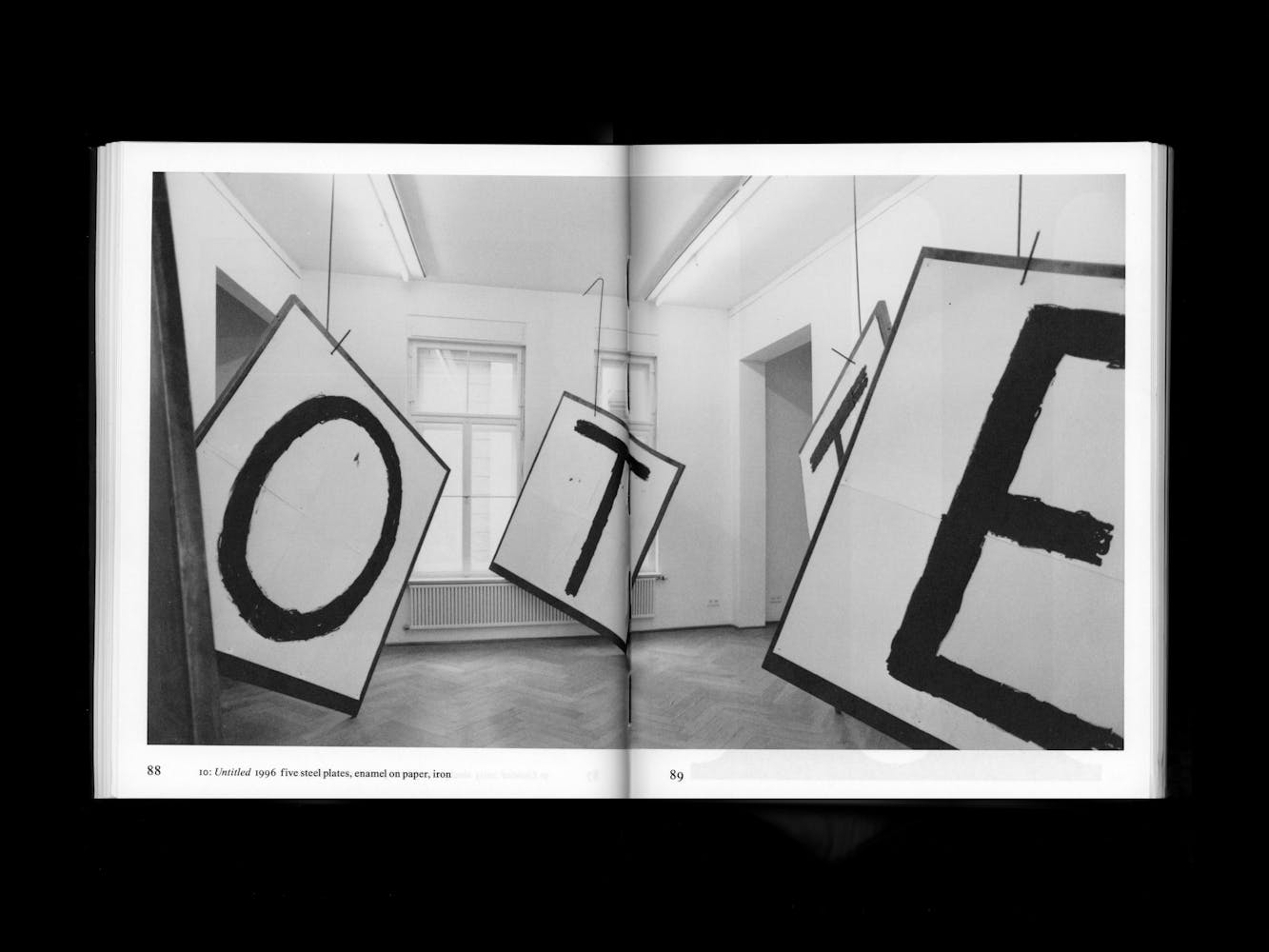 Spread of a book with pictures of artwork.