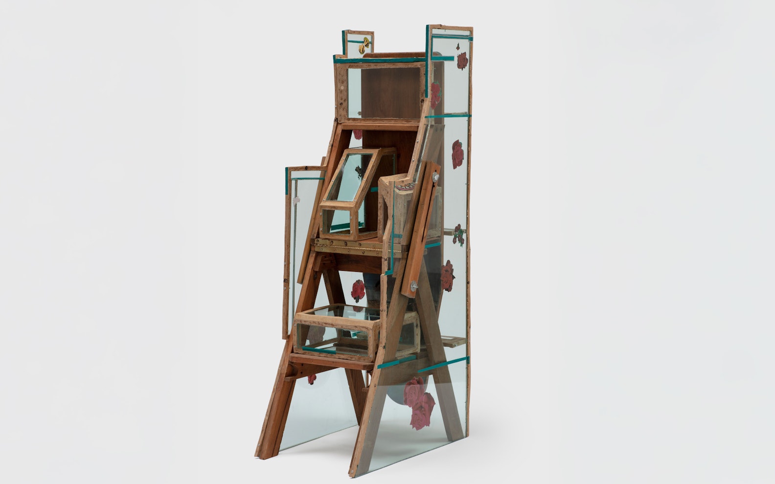 Jessi-Reaves-Program---Hero A triangular wooden form with light blue see-through plexiglass sides.