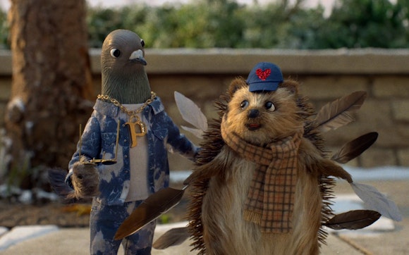 A claymation bird and hedgehog stand next to one another.