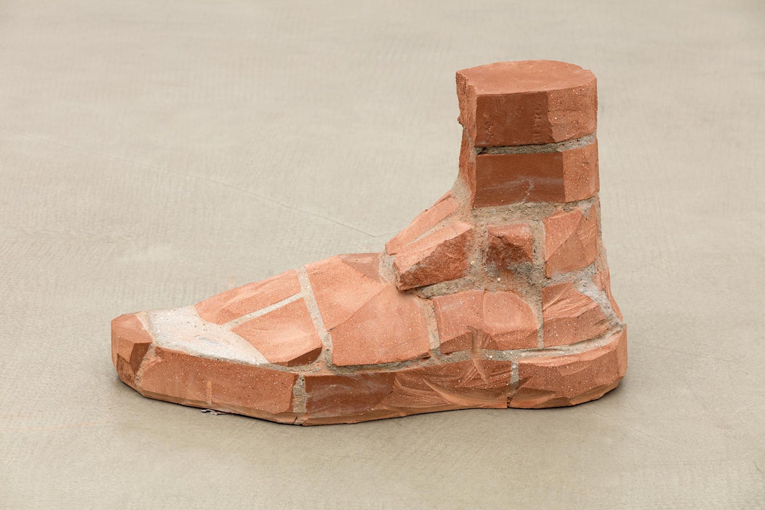 sculpture of a foot made of brick