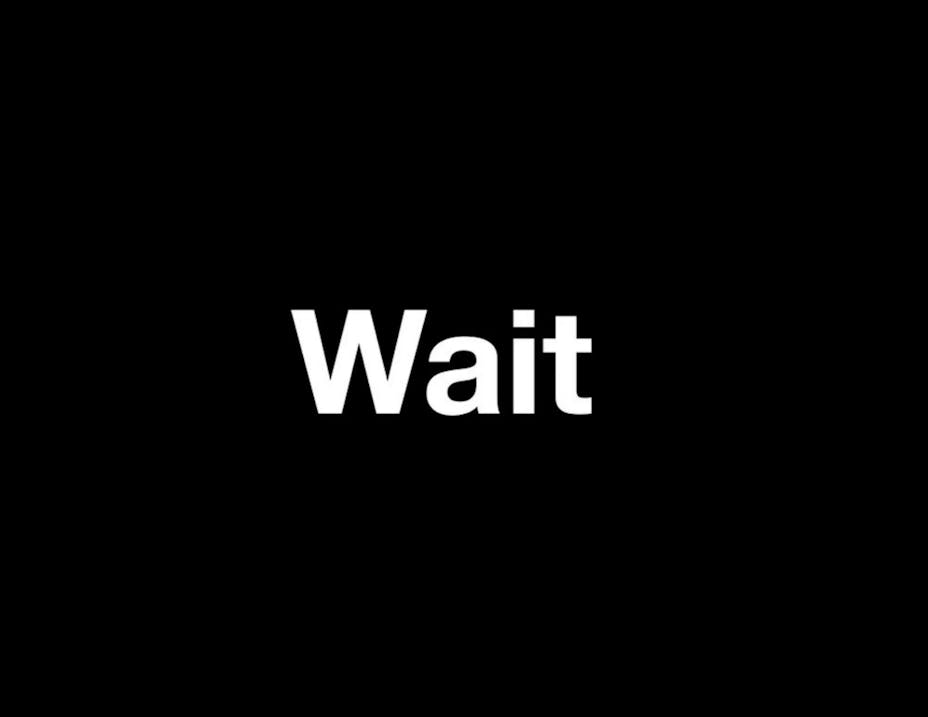 All black with white text "Wait".