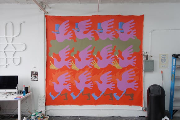 Painted canvas featuring repeated dove pattern in bright colors