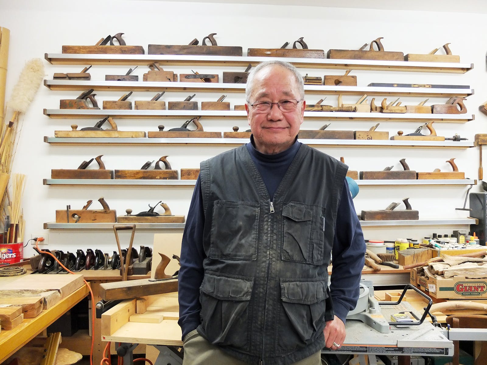 Kinji Akagawa standing in workshop.