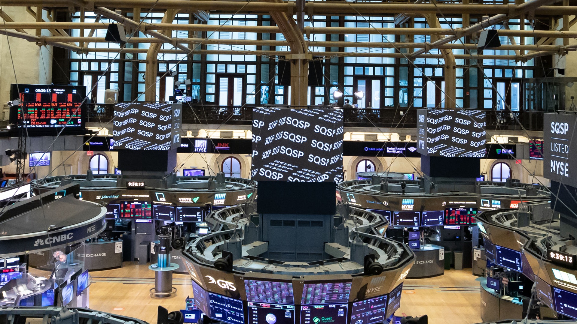 Inside a large building with many screens.