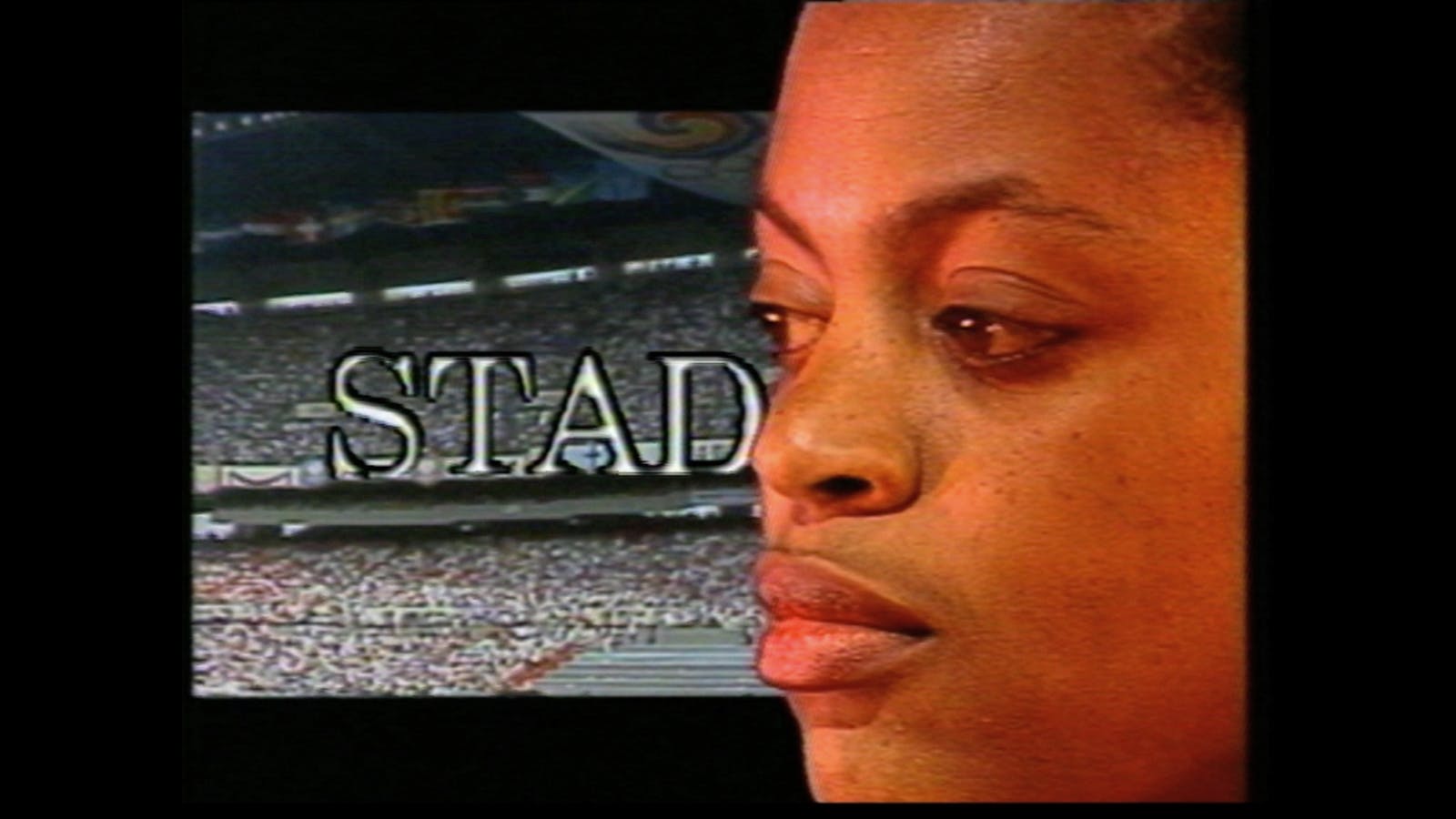 Still image of a stadium with the text “STAD” behind a close up face covering the right side of the image.