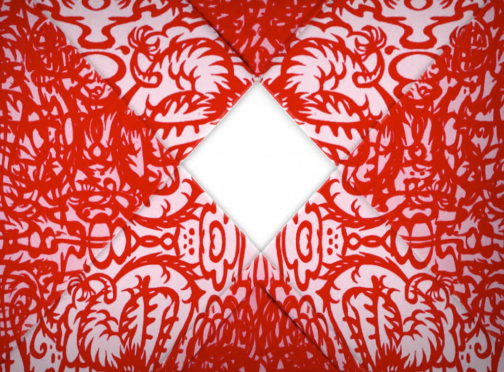 Image of “X” formed in red damask like pattern.