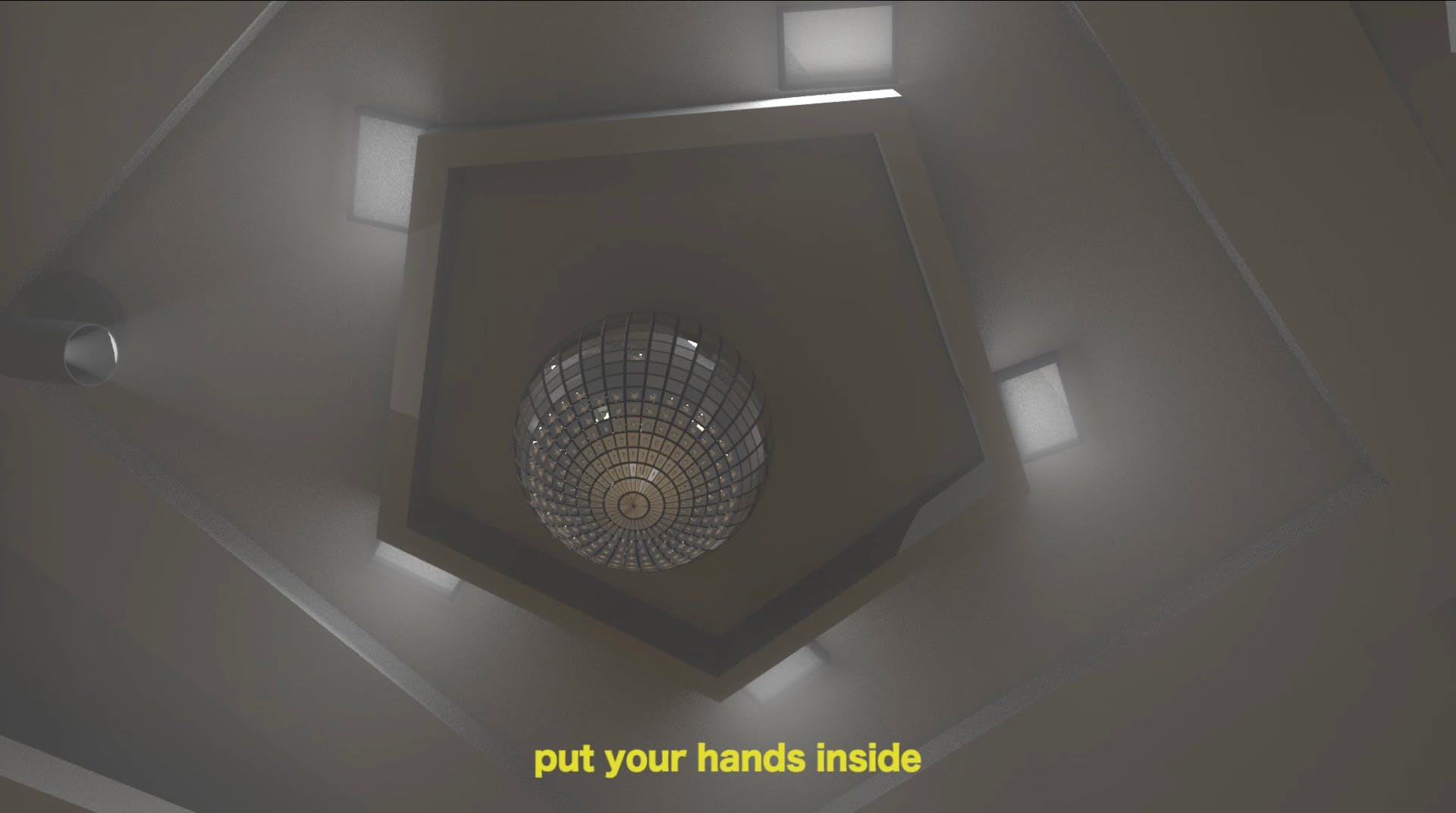 A view looking up at disco ball on a ceiling. Caption below reads: "put your hands inside"
