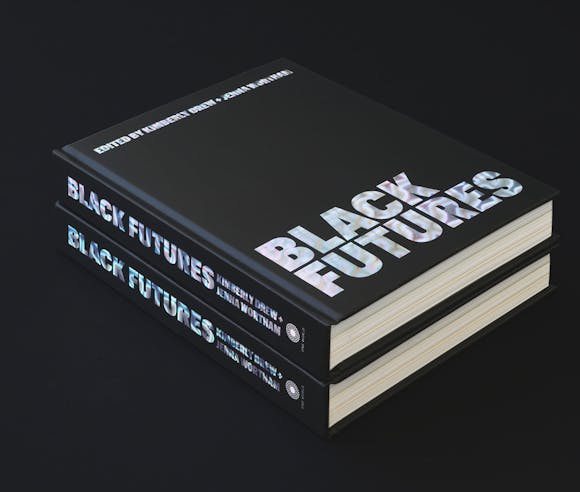Two black books sitting on black background with the type "Black Futures" on the cover