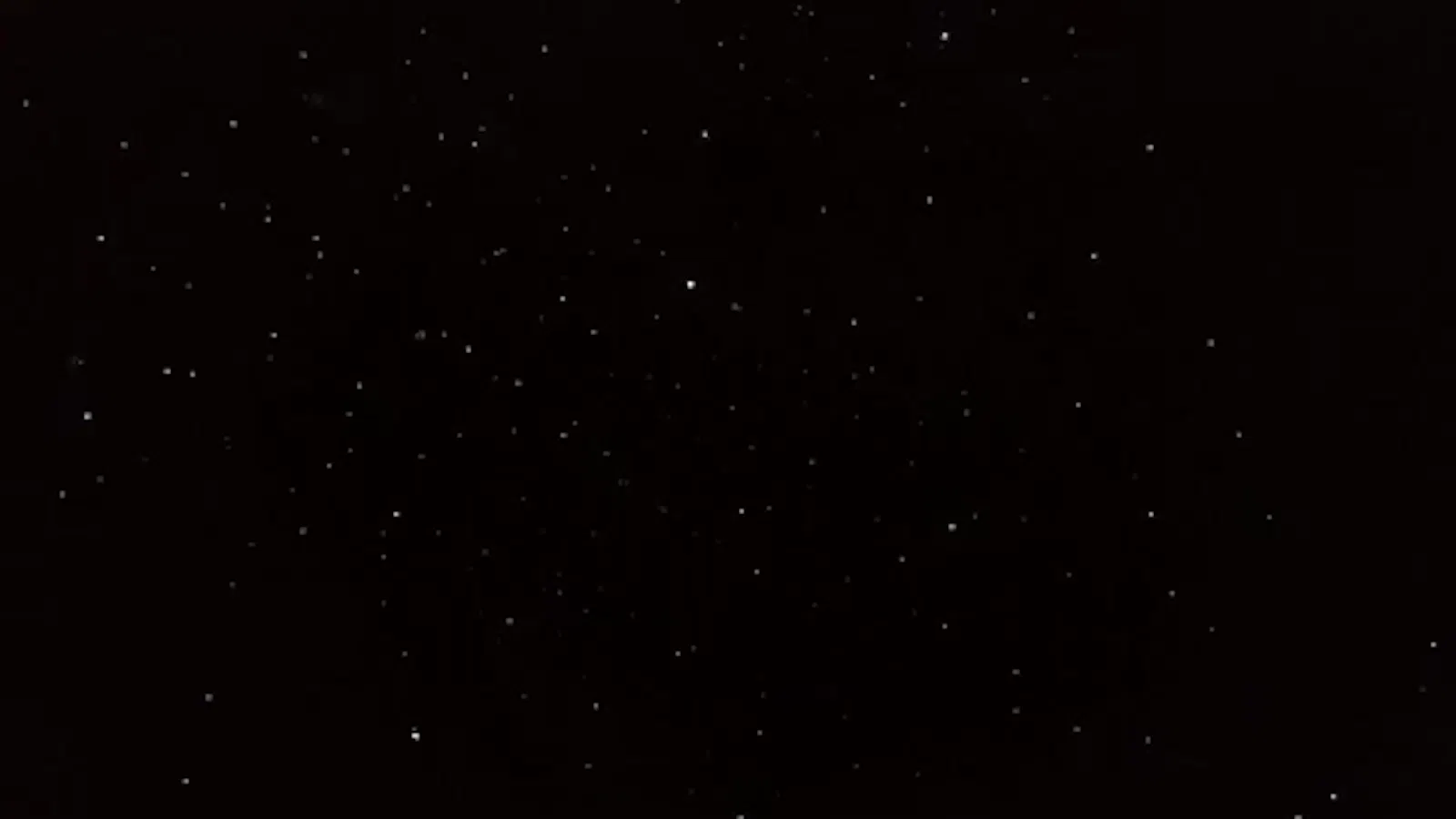 Stars move in the darkness.