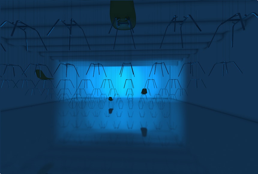Chairs hanging from the ceiling in a gallery lit with blue light