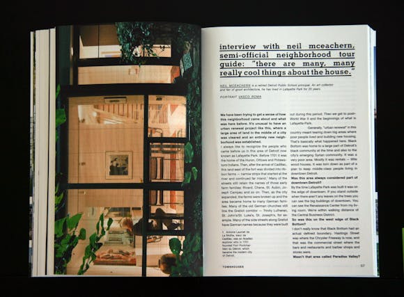 open book spread with image of interior on the left and text on right hand page