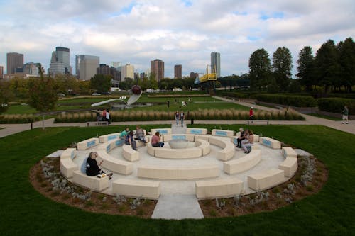 The Walker-commissioned piece, titled Okciyapi (2021), is the first public artwork by a Native artist to be sited in the Garden. Both a gathering place and participatory work, the sculpture is composed of rings of seating elements surrounding a central water feature.