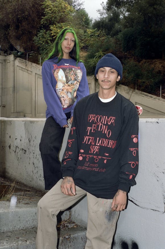 Image of two models wearing graphic tshirts