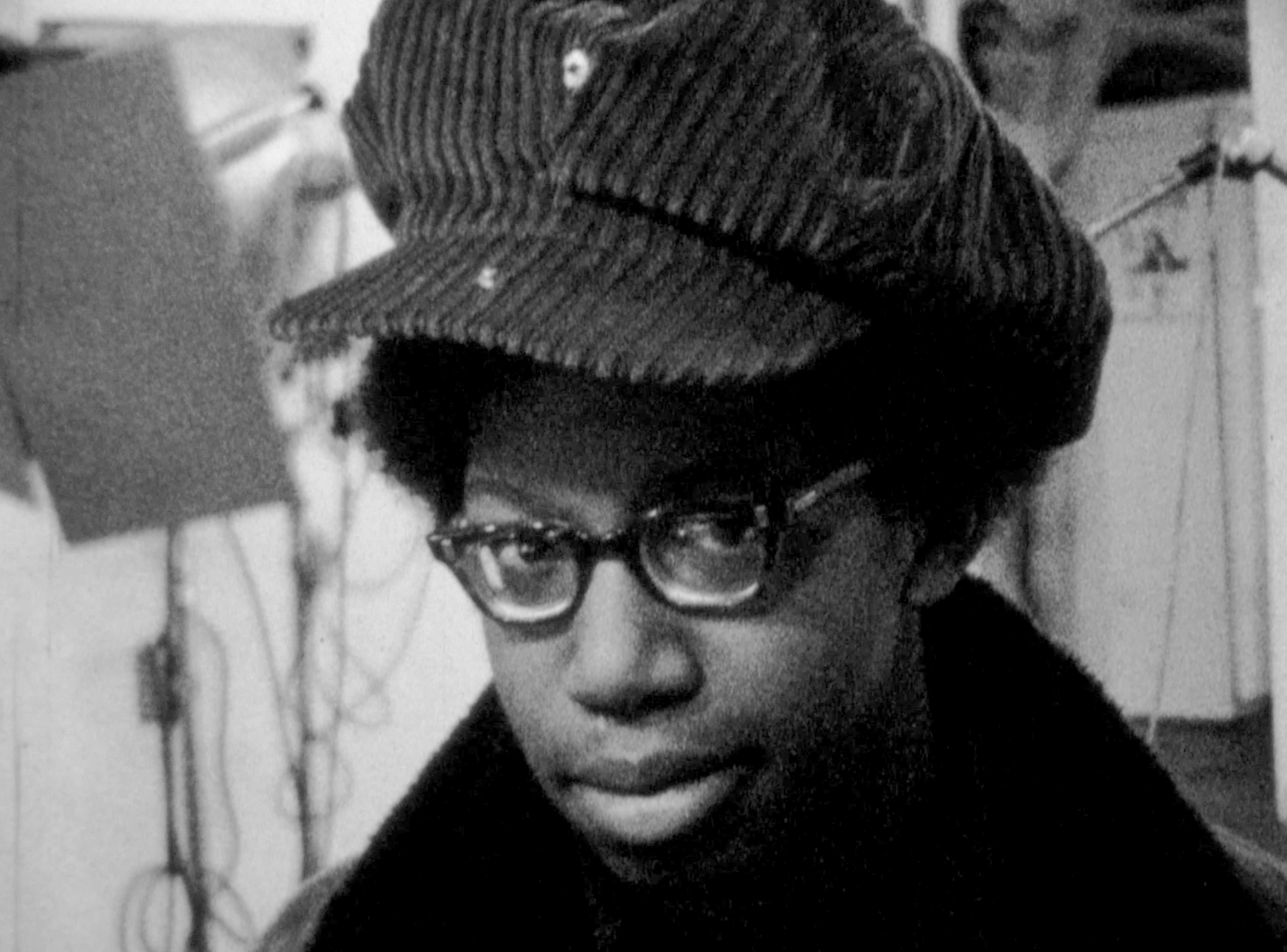 Portrait of a young boy in hat and glasses in the Film in the Cities studio