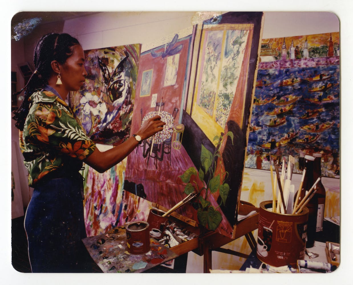 A woman paints in her studio.