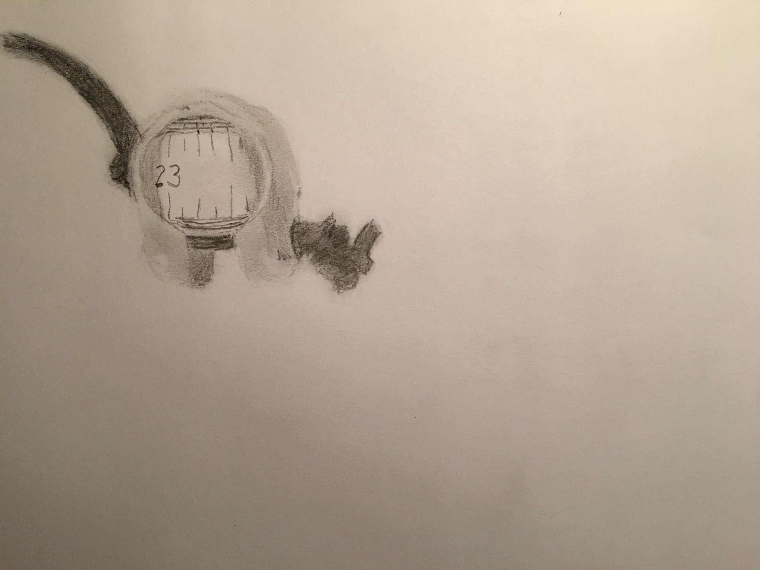 A black-and-white drawing of a horseshoe-shaped piece of metal with a rolled-up measuring tape stuck inside showing the number 23.