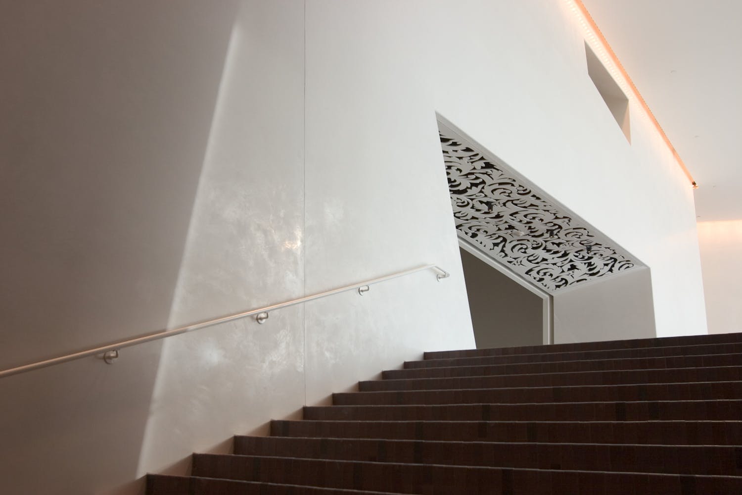 A stairwell leading to a gallery in a museum.