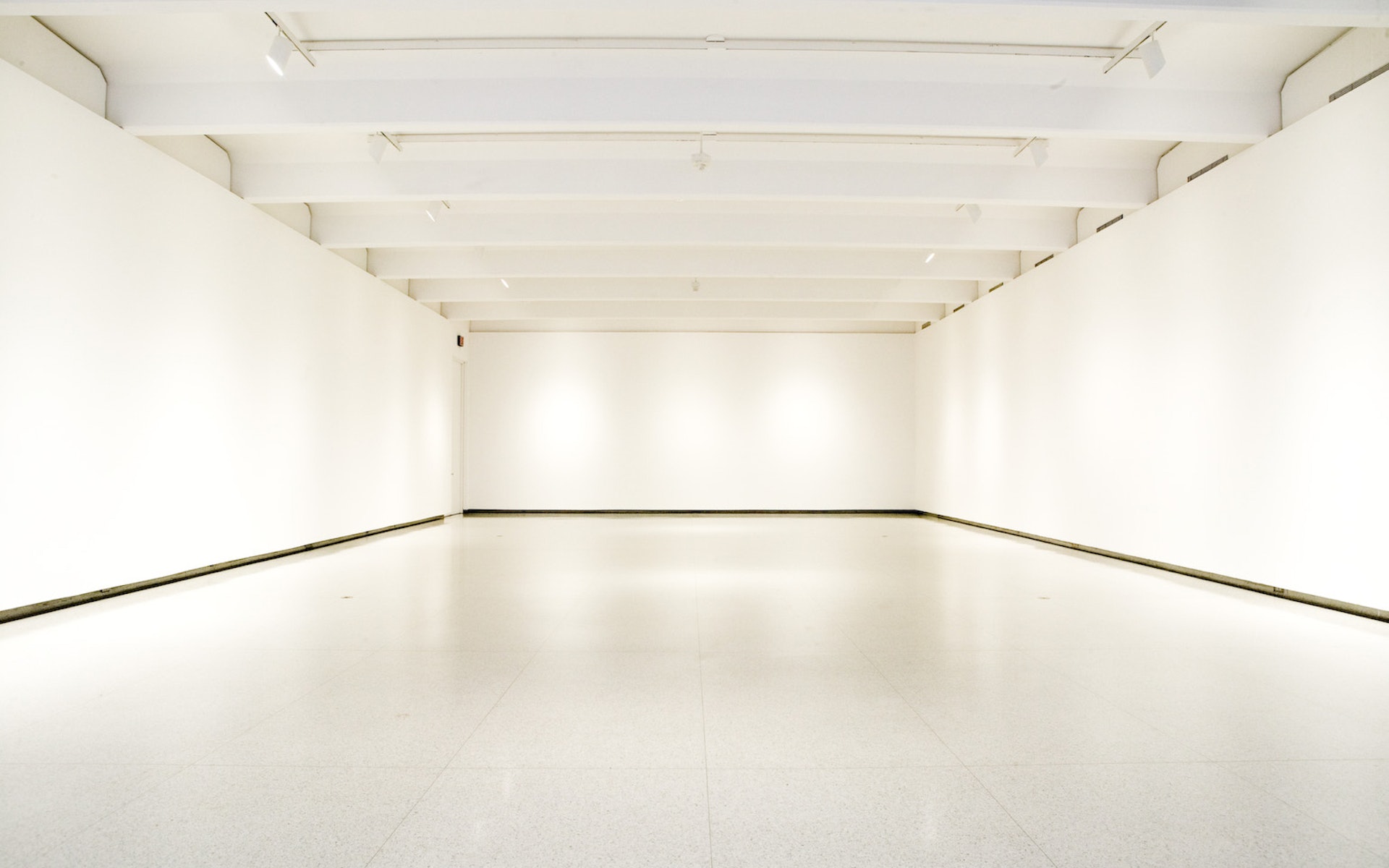 An empty white art gallery.