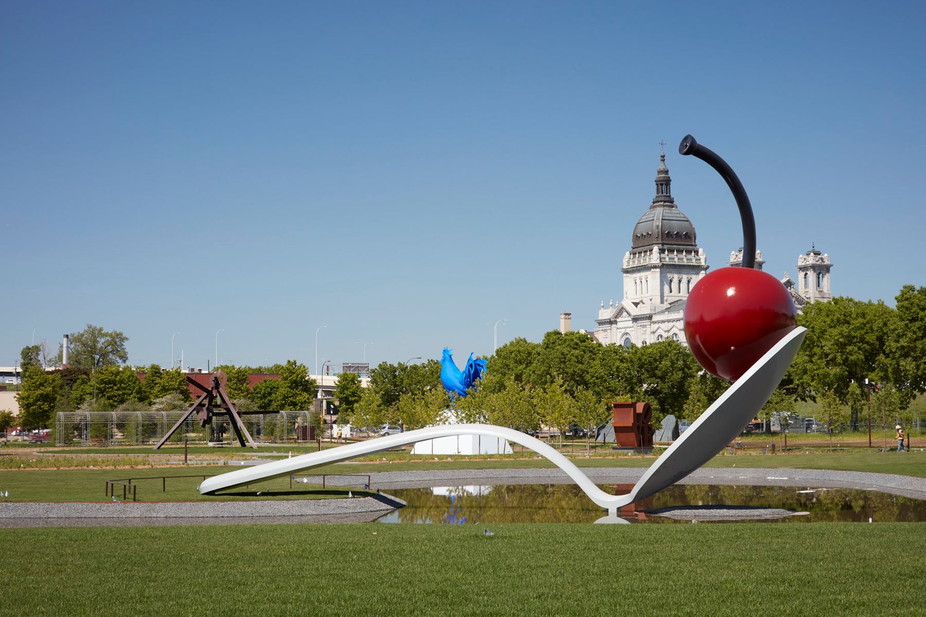 giant sculpture of cherry on a spoon
